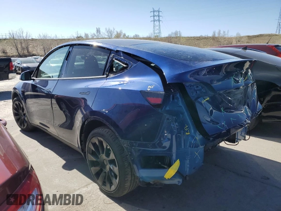 2023 Tesla Model Y Long Range with VIN 7SAYGAEE6PF689615, listed as a Copart auction lot 50999385 with 16,514 mi miles and Salvage Title. Bid and sale history available at DreamBid. Image 2.
