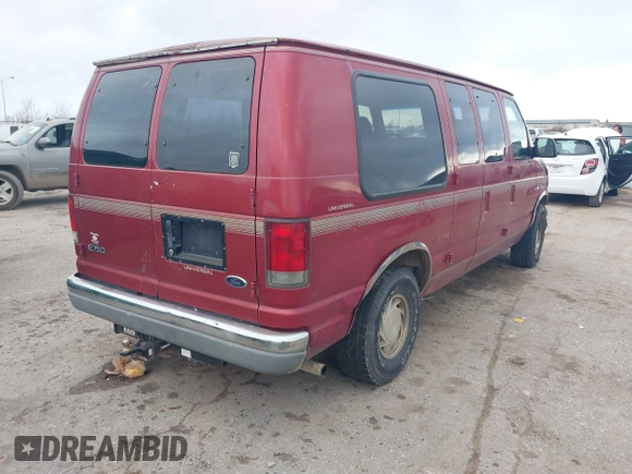 1999 Ford Econoline Cargo with VIN 1FDRE14W0XHB06565, listed as a IAAI auction lot 41496511 with 165,268 mi miles. Bid and sale history available at carsss.com. Image 4.