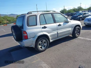 2000 Suzuki Grand Vitara z VIN JS3TE62V6Y4109305, wystawiony jako IAAI lot #41937744 z przebiegiem 255 231 mil mil oraz . Historia ofert i sprzedaży dostępna na DreamBid. Obrazek 4.