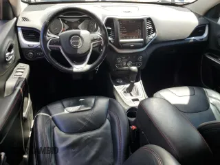 2014 Jeep Cherokee Trailhawk with VIN 1C4PJMBS7EW170345, listed as a Copart auction lot 60565765 with 98,382 mi miles and Salvage title. Bid and sale history available at DreamBid. Image 8.