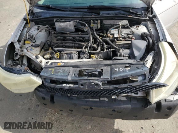 2008 Ford Focus SE z VIN 1FAHP35N18W272057, wystawiony jako Copart lot #59867425 z przebiegiem 293 894 mil mil oraz Szkoda całkowita • Salvage title. Historia ofert i sprzedaży dostępna na DreamBid. Obrazek 11.
