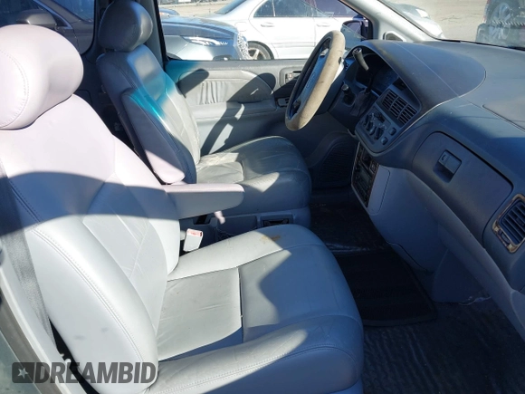 1999 Toyota Sienna LE with VIN 4T3ZF13C3XU103436, listed as a IAAI auction lot 41667242 with 228,318 mi miles. Bid and sale history available at carsss.com. Image 5.