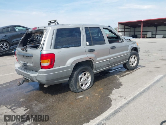 2000 Jeep Grand Cherokee Laredo with VIN 1J4GW48N5YC322707, listed as a IAAI auction lot 42080677 with Not provided miles and . Bid and sale history available at DreamBid. Image 4.