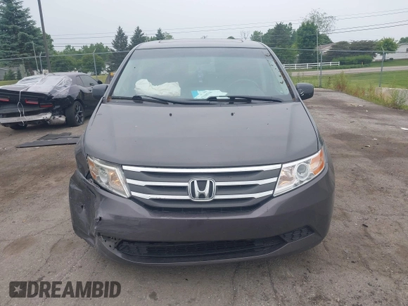 2011 Honda Odyssey EX-L with VIN 5FNRL5H64BB029087, listed as a IAAI auction lot 42508764 with 214,705 mi miles and . Bid and sale history available at DreamBid. Image 12.