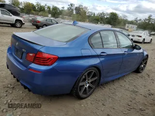 2014 BMW M5 z VIN WBSFV9C5XED097563, wystawiony jako Copart lot #72175354 z przebiegiem 73 406 mil mil oraz Szkody całkowita. Historia ofert i sprzedaży dostępna na DreamBid. Obrazek 3.