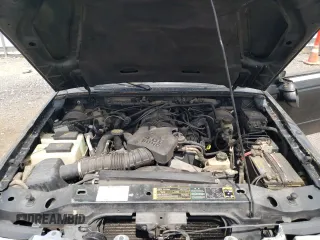 2005 Ford Ranger XLT z VIN 1FTZR45E65PA93596, wystawiony jako Copart lot #54162995 z przebiegiem 168 574 mil mil oraz Nie do naprawy • Non repairable. Historia ofert i sprzedaży dostępna na DreamBid. Obrazek 11.
