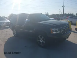 2009 Chevrolet Tahoe LTZ with VIN 1GNFC33089R297033, listed as a IAAI auction lot 42850828 with 310,614 mi miles and . Bid and sale history available at DreamBid. Image 1.