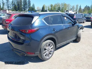 2020 Mazda CX-5 Grand Touring with VIN JM3KFBDM7L0724005, listed as a IAAI auction lot 42034658 with 90,631 mi miles. Bid and sale history available at carsss.com. Image 4.