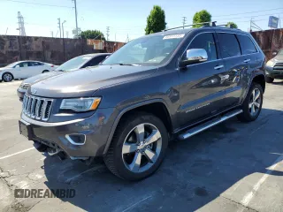 2015 Jeep Grand Cherokee Overland z VIN 1C4RJFCG0FC894766, wystawiony jako Copart lot #56913155 z przebiegiem 166 830 mil mil oraz Szkoda całkowita • Salvage title. Historia ofert i sprzedaży dostępna na DreamBid. Obrazek 1.