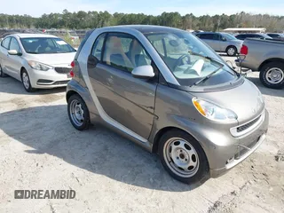 2012 Smart fortwo Pure z VIN WMEEJ3BA9CK557221, wystawiony jako IAAI lot #41828029 z przebiegiem 54 516 mil mil oraz . Historia ofert i sprzedaży dostępna na DreamBid. Obrazek 1.