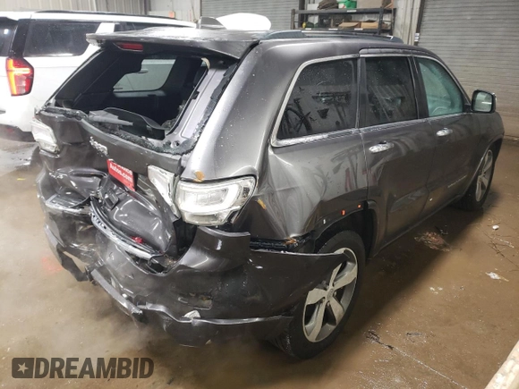 2015 Jeep Grand Cherokee Overland with VIN 1C4RJFCT2FC613502, listed as a Copart auction lot 89207005 with 124,482 mi miles and Salvage Title. Bid and sale history available at carsss.com. Image 3.