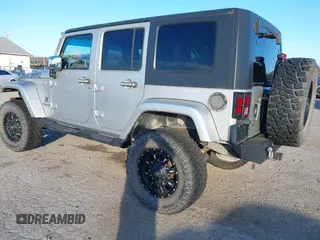 2010 Jeep Wrangler Unlimited Sahara with VIN 1J4BA5H14AL230604, listed as a IAAI auction lot 41884346 with 97,060 mi miles. Bid and sale history available at carsss.com. Image 3.