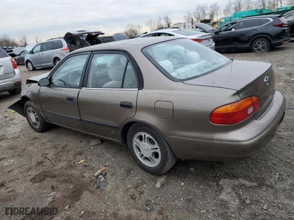 2000 Chevrolet Prizm with VIN 1Y1SK5283YZ425556, listed as a Copart auction lot 83388554 with 104,580 mi miles and Salvage Title. Bid and sale history available at carsss.com. Image 2.
