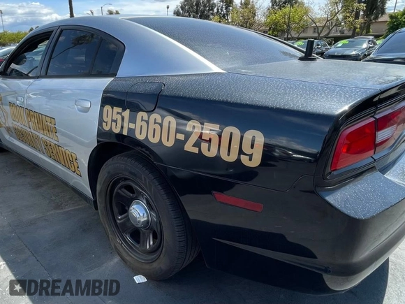2012 Dodge Charger Police with VIN 2C3CDXAG0CH295515, listed as a Copart auction lot 51870315 with 128,837 mi miles and Clean Title. Bid and sale history available at carsss.com. Image 3.