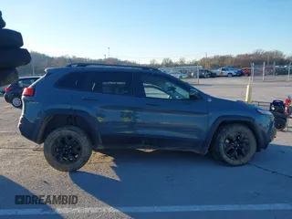 2015 Jeep Cherokee Trailhawk with VIN 1C4PJMBSXFW614416, listed as a IAAI auction lot 41033241 with 112,015 mi miles. Bid and sale history available at carsss.com. Image 14.