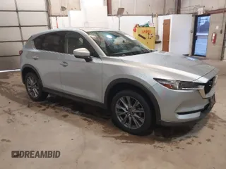2021 Mazda CX-5 Grand Touring with VIN JM3KFADMXM1318015, listed as a IAAI auction lot 41221528 with 79,473 mi miles. Bid and sale history available at carsss.com. Image 1.