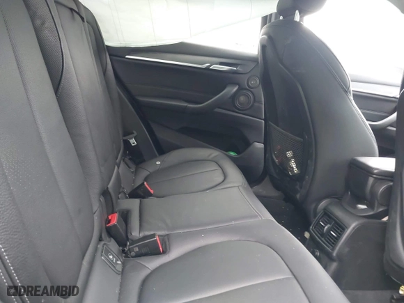 2018 BMW X1 xDrive28i with VIN WBXHT3C34J5K21576, listed as a IAAI auction lot 41822390 with 69,645 mi miles. Bid and sale history available at carsss.com. Image 8.