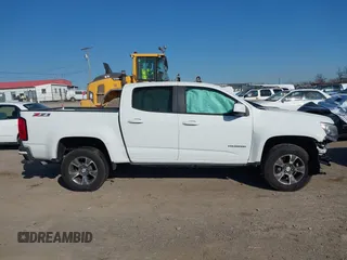 2019 Chevrolet Colorado 4WD Z71 z VIN 1GCGTDEN9K1135489, wystawiony jako IAAI lot #41752283 z przebiegiem 180 854 mil mil oraz . Historia ofert i sprzedaży dostępna na DreamBid. Obrazek 13.