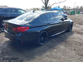 2020 BMW M5 with VIN WBSJF0C05LCE51499, listed as a IAAI auction lot 41982940 with 47,076 mi miles. Bid and sale history available at carsss.com. Image 4.