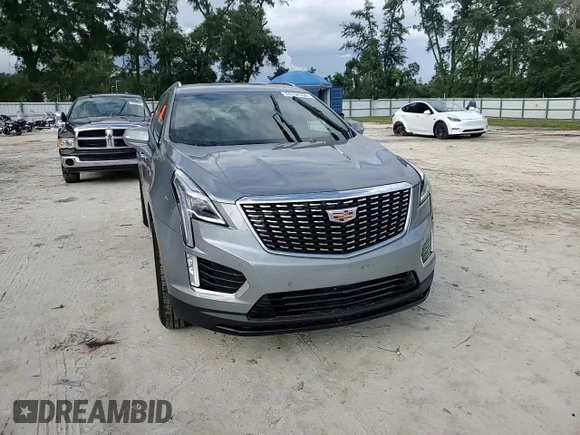 2023 Cadillac XT5 FWD Luxury z VIN 1GYKNAR4XPZ144533, wystawiony jako Copart lot #74734164 z przebiegiem Nie podano mil oraz Nie do naprawy • Non repairable. Historia ofert i sprzedaży dostępna na DreamBid. Obrazek 11.