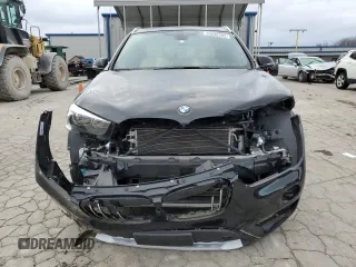 2018 BMW X1 xDrive28i with VIN WBXHT3C33J5L24195, listed as a Copart auction lot 38830283 with 35,004 mi miles. Bid and sale history available at carsss.com. Image 5.