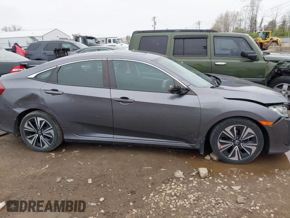 2017 Honda Civic EX-T with VIN 19XFC1F34HE014334, listed as a IAAI auction lot 42009311 with 124,717 mi miles. Bid and sale history available at carsss.com. Image 13.