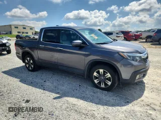 2017 Honda Ridgeline RTL-E with VIN 5FPYK3F79HB031142, listed as a Copart auction lot 62365885 with 134,517 mi miles and Salvage title. Bid and sale history available at DreamBid. Image 4.