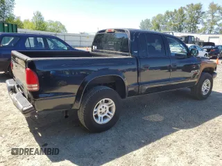 2001 Dodge Dakota Sport z VIN 1B7GG2AN81S113605, wystawiony jako Copart lot #58990065 z przebiegiem 243 919 mil mil oraz Tytuł czysty. Historia ofert i sprzedaży dostępna na DreamBid. Obrazek 3.