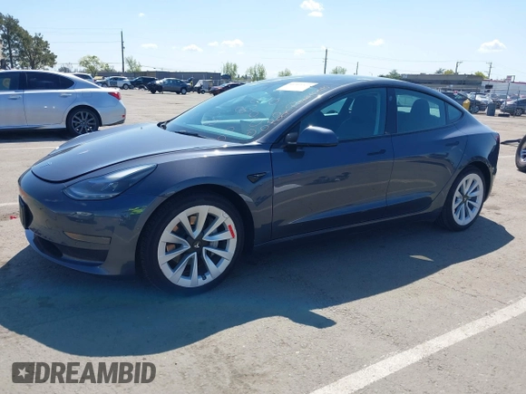2022 Tesla Model 3 with VIN 5YJ3E1EA6NF144098, listed as a IAAI auction lot 41965360 with 75,597 mi miles. Bid and sale history available at carsss.com. Image 2.