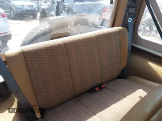 1998 Jeep Wrangler Sport z VIN 1J4FY19S3WP776209, wystawiony jako IAAI lot #42493513 z przebiegiem 113 130 mil mil oraz . Historia ofert i sprzedaży dostępna na DreamBid. Obrazek 8.