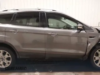 2014 Ford Escape Titanium with VIN 1FMCU9JX9EUA56421, listed as a IAAI auction lot 41392372 with 117,234 mi miles. Bid and sale history available at carsss.com. Image 14.