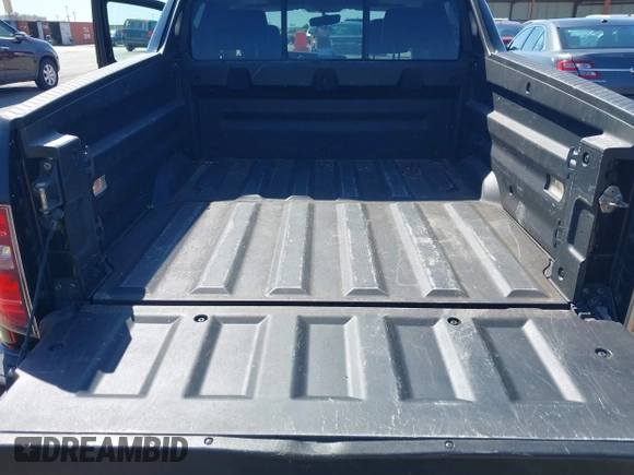 2013 Honda Ridgeline RTL with VIN 5FPYK1F57DB005538, listed as a IAAI auction lot 41985586 with 152,697 mi miles and . Bid and sale history available at DreamBid. Image 12.