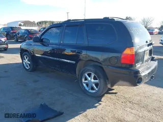 2009 GMC Envoy SLT with VIN 1GKDT43S792132160, listed as a IAAI auction lot 41876839 with 203,236 mi miles. Bid and sale history available at carsss.com. Image 3.