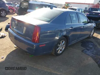 2009 Cadillac STS AWD w/1SB with VIN 1G6DD67VX90130281, listed as a IAAI auction lot 41384191 with 102,943 mi miles. Bid and sale history available at carsss.com. Image 4.