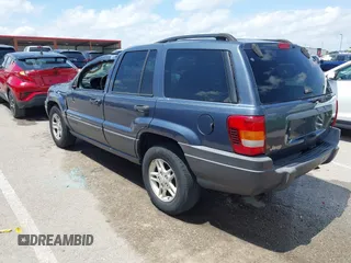 2004 Jeep Grand Cherokee Laredo with VIN 1J4GX48S44C205469, listed as a IAAI auction lot 42310571 with 154,929 mi miles and . Bid and sale history available at DreamBid. Image 3.