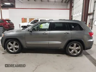 2013 Jeep Grand Cherokee Overland with VIN 1C4RJFCT9DC524605, listed as a IAAI auction lot 42016103 with 215,352 mi miles. Bid and sale history available at carsss.com. Image 14.