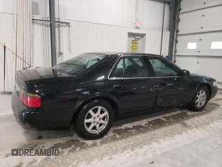 2002 Cadillac Seville Touring STS z VIN 1G6KY54962U158476, wystawiony jako Copart lot #86624774 z przebiegiem 77 818 mil mil oraz Szkoda całkowita • Salvage title. Historia ofert i sprzedaży dostępna na DreamBid. Obrazek 3.