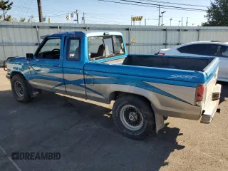 1991 Ford Ranger with VIN 1FTCR15T2MTA45652, listed as a Copart auction lot 76089874 with 90,947 mi miles and Salvage Title. Bid and sale history available at DreamBid. Image 2.