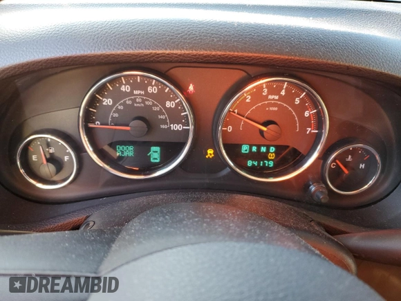2011 Jeep Wrangler Sahara with VIN 1J4GA5D14BL628876, listed as a Copart auction lot 87317374 with 84,179 mi miles and Salvage Title. Bid and sale history available at DreamBid. Image 9.