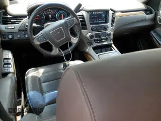 2019 GMC Yukon Denali with VIN 1GKS1CKJ0KR259491, listed as a Copart auction lot 51071335 with 105,294 mi miles and Salvage Title. Bid and sale history available at carsss.com. Image 8.
