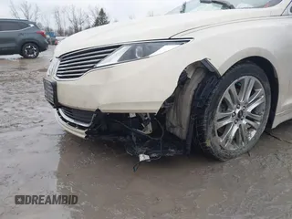 2015 Lincoln MKZ z VIN 3LN6L2J96FR618325, wystawiony jako IAAI lot #41046851 z przebiegiem Nie podano mil oraz . Historia ofert i sprzedaży dostępna na DreamBid. Obrazek 6.