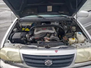 2001 Suzuki XL7 Standard z VIN JS3TX92V814116919, wystawiony jako Copart lot #72758694 z przebiegiem 185 153 mil mil oraz Szkoda całkowita • Salvage title. Historia ofert i sprzedaży dostępna na DreamBid. Obrazek 13.