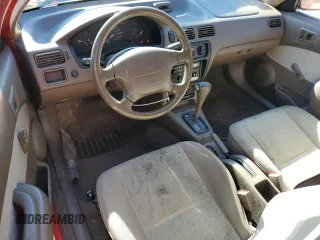 1997 Toyota Tercel CE z VIN JT2AC52L8V0287765, wystawiony jako Copart lot #75894284 z przebiegiem 97 018 mil mil oraz Tytuł czysty. Historia ofert i sprzedaży dostępna na DreamBid. Obrazek 8.