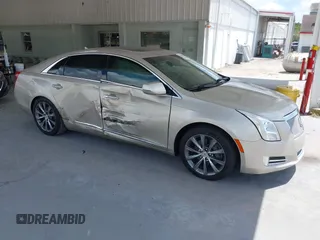2013 Cadillac XTS Luxury z VIN 2G61P5S37D9214177, wystawiony jako IAAI lot #42149379 z przebiegiem 106 084 mil mil oraz . Historia ofert i sprzedaży dostępna na DreamBid. Obrazek 1.