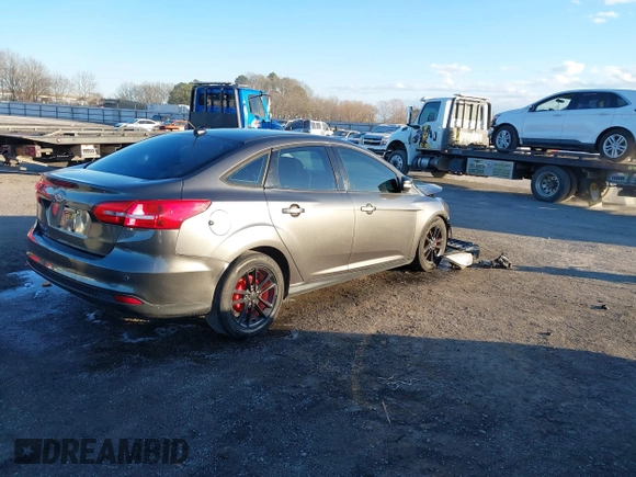 2015 Ford Focus SE with VIN 1FADP3F29FL384879, listed as a IAAI auction lot 41335839 with 107,871 mi miles. Bid and sale history available at carsss.com. Image 4.