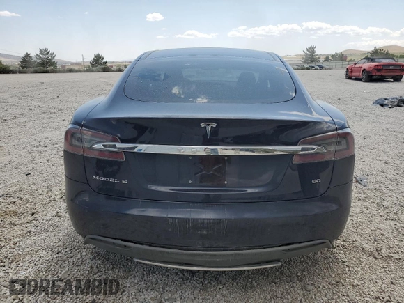 2014 Tesla Model S 60 with VIN 5YJSA1S12EFP29885, listed as a Copart auction lot 59769215 with Not provided miles and Salvage title. Bid and sale history available at DreamBid. Image 6.