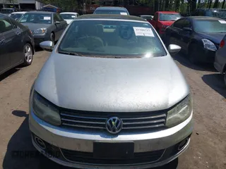 2012 Volkswagen Eos Komfort with VIN WVWBW7AH8CV001621, listed as a IAAI auction lot 41988717 with 146,882 mi miles and . Bid and sale history available at DreamBid. Image 6.