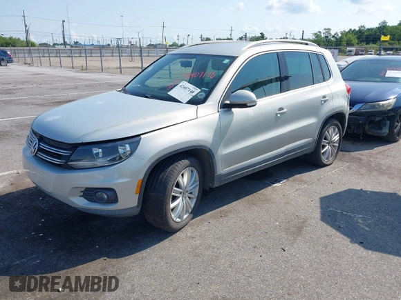 2012 Volkswagen Tiguan SE with VIN WVGAV7AX9CW581957, listed as a IAAI auction lot 42407148 with 135,553 mi miles and . Bid and sale history available at DreamBid. Image 2.