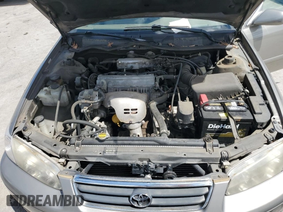 2000 Toyota Camry CE z VIN 4T1BG22KXYU639808, wystawiony jako Copart lot #56606985 z przebiegiem 119 678 mil mil oraz Szkoda całkowita • Salvage title. Historia ofert i sprzedaży dostępna na DreamBid. Obrazek 11.