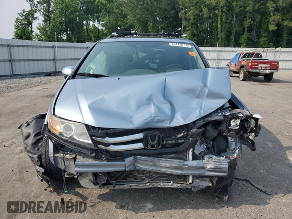 2014 Honda Odyssey Touring with VIN 5FNRL5H95EB080449, listed as a Copart auction lot 58489715 with 154,604 mi miles and Salvage title. Bid and sale history available at DreamBid. Image 5.